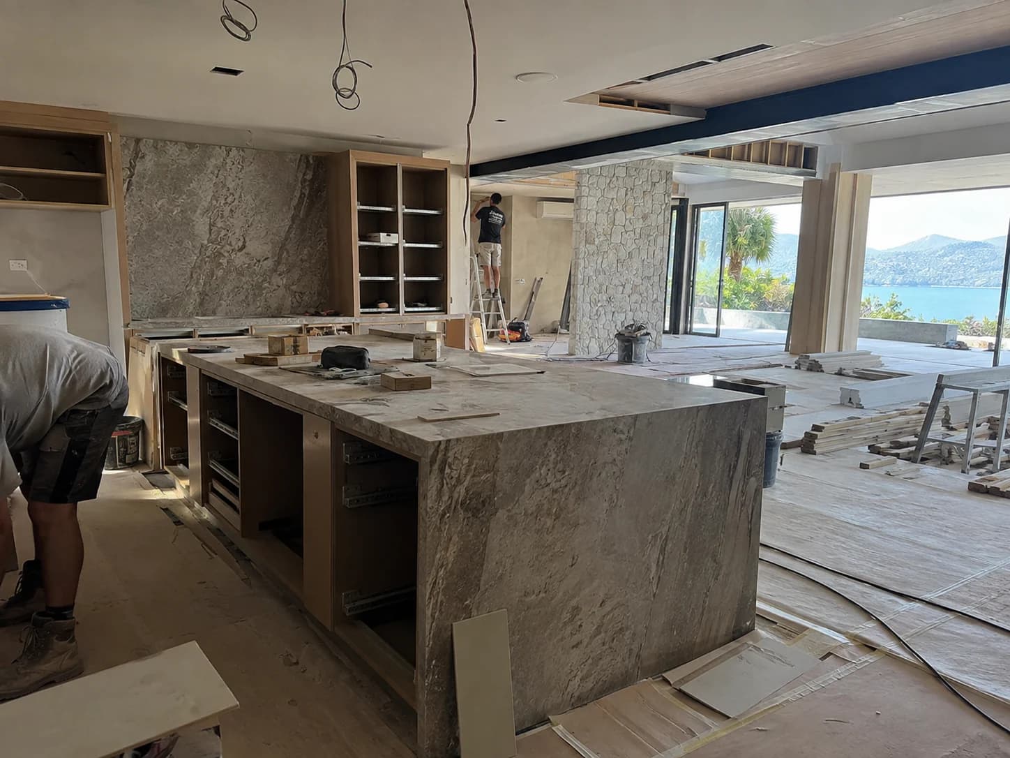 Kitchen and living space mid fit-out with trades on site