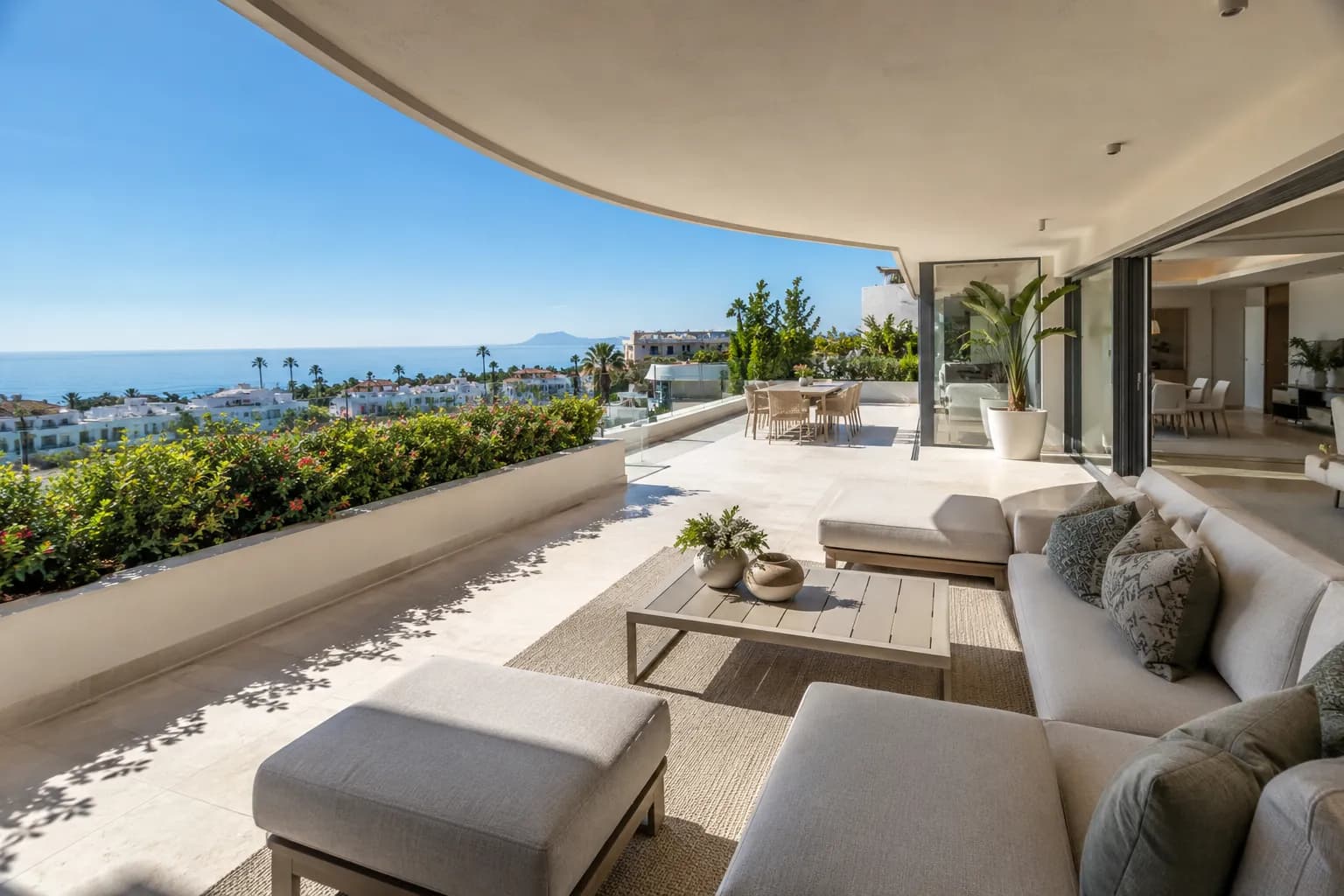Finished coastal terrace with outdoor seating after renovation in Marbella