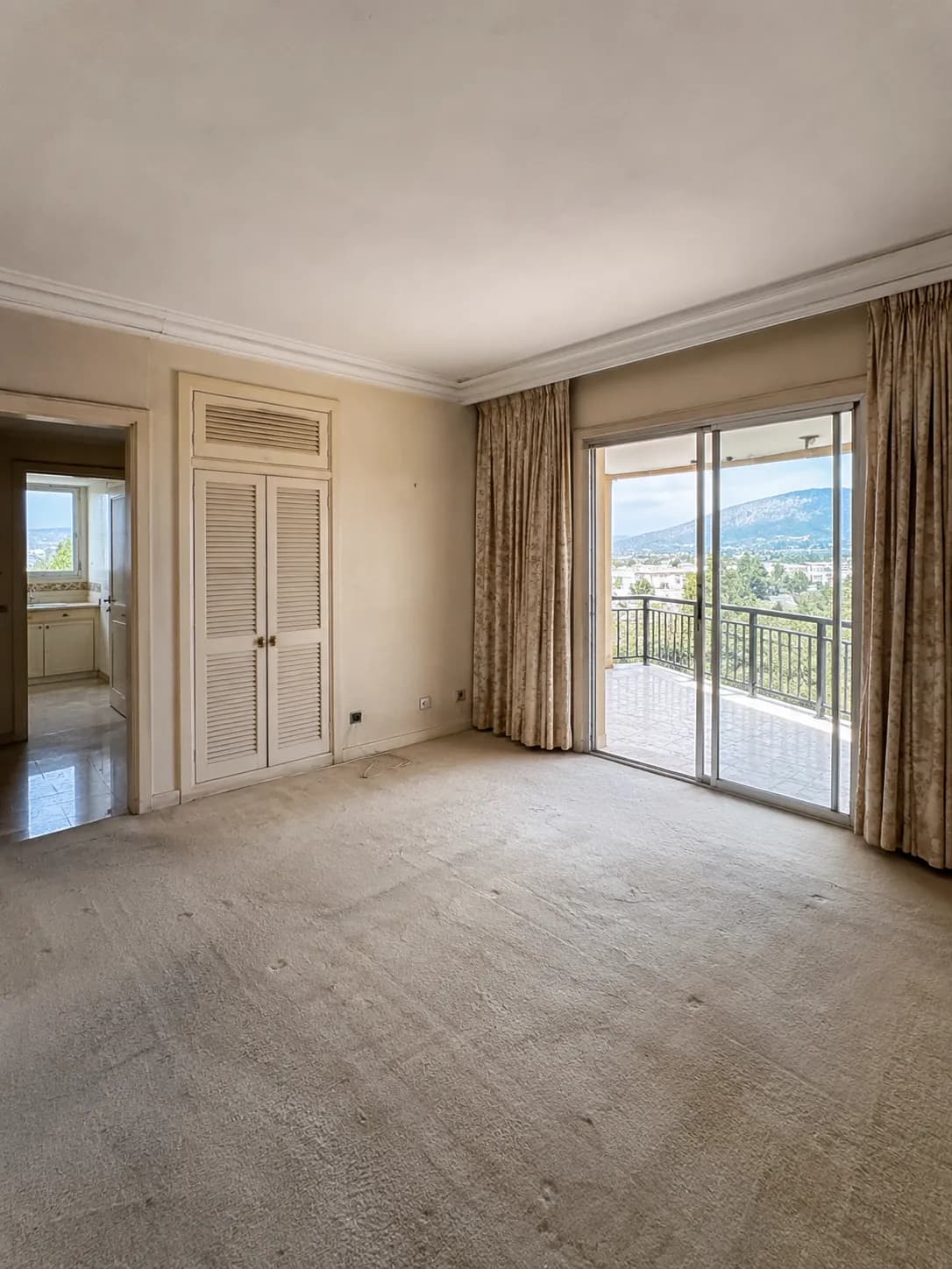 Dated enclosed living area before the penthouse renovation